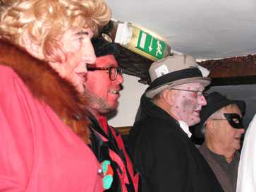 The gang watching the horse as the performance comes to a close